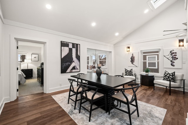 dining space featuring vaulted ceiling with skylight, baseboards, recessed lighting, and dark wood-style flooring