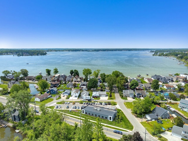 birds eye view of property featuring a residential view and a water view