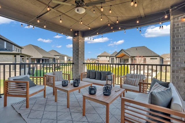 view of patio / terrace with an outdoor living space, a ceiling fan, and a residential view