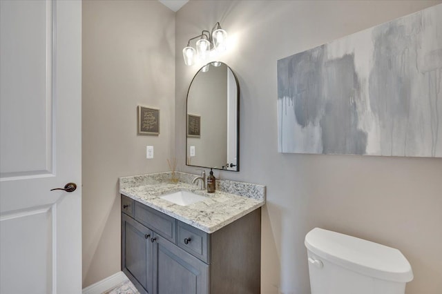 bathroom with toilet and vanity