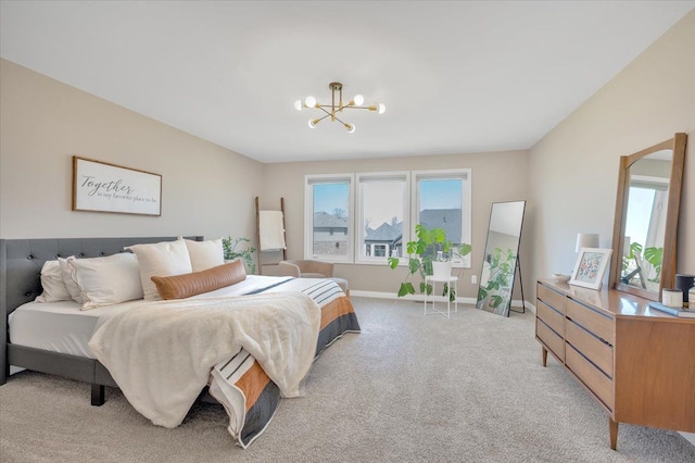bedroom with light carpet, a chandelier, and baseboards