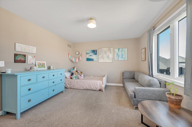 bedroom with light colored carpet, baseboards, and visible vents