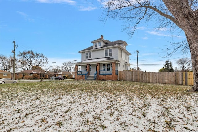 back of property featuring a porch, a chimney, fence, and brick siding
