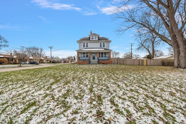 back of property with brick siding and fence