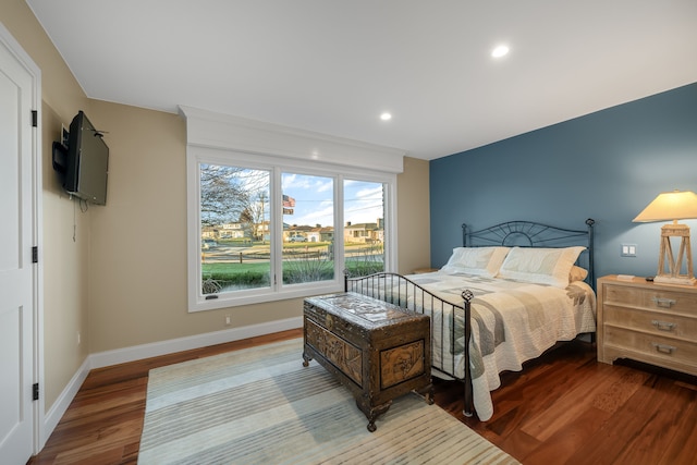 bedroom featuring recessed lighting, wood finished floors, and baseboards