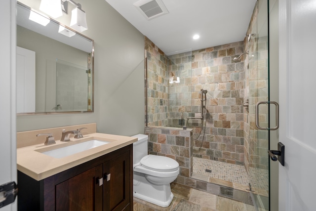 bathroom featuring recessed lighting, a shower stall, visible vents, toilet, and vanity