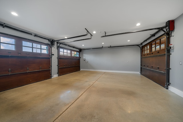 garage with baseboards and recessed lighting