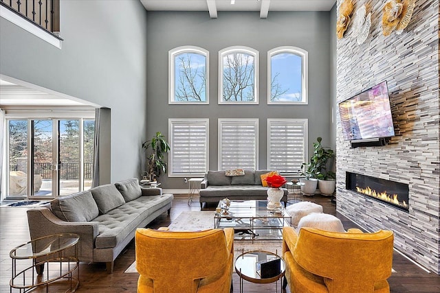 3888 Thatcher Dr, Rochester Hills, MI 48309 - living room with a stone fireplace, wood finished floors, and a towering ceiling