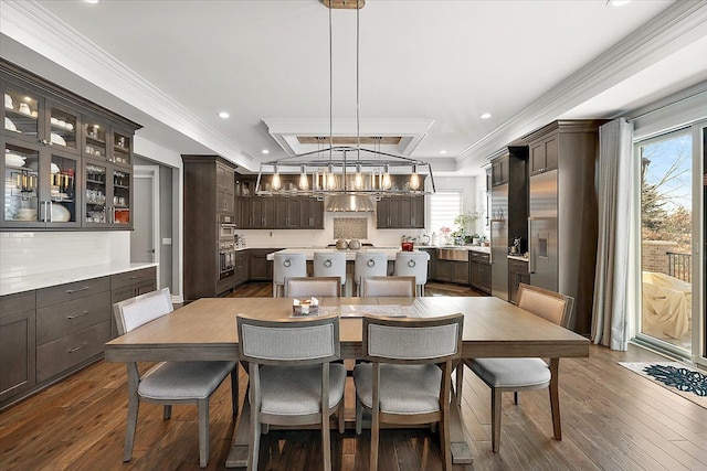 3888 Thatcher Dr, Rochester Hills, MI 48309 - dining space featuring dark wood finished floors, a wealth of natural light, ornamental molding, and recessed lighting