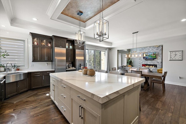 3888 Thatcher Dr, Rochester Hills, MI 48309 - kitchen with a sink, an inviting chandelier, stainless steel built in fridge, dark wood-type flooring, and a raised ceiling