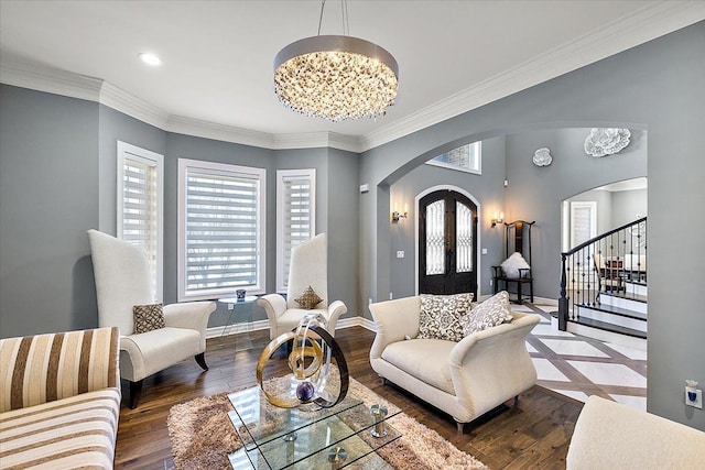 3888 Thatcher Dr, Rochester Hills, MI 48309 - living area featuring a notable chandelier, arched walkways, stairs, and hardwood / wood-style floors