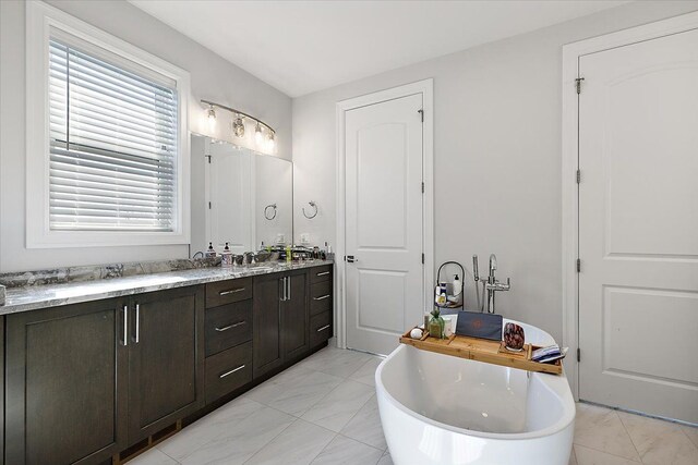 3888 Thatcher Dr, Rochester Hills, MI 48309 - full bathroom featuring a soaking tub, marble finish floor, a sink, and double vanity