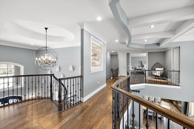 3888 Thatcher Dr, Rochester Hills, MI 48309 - hallway with recessed lighting, an upstairs landing, wood-type flooring, baseboards, and a notable chandelier