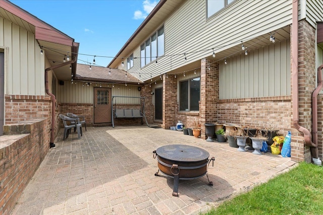 view of patio with a fire pit