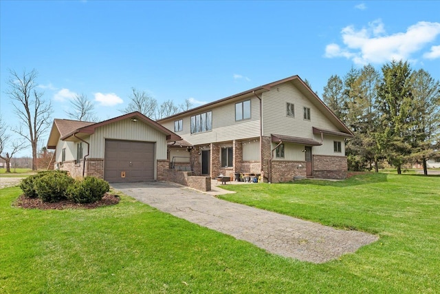 view of front of home with an attached garage, a front yard, aphalt driveway, and brick siding
