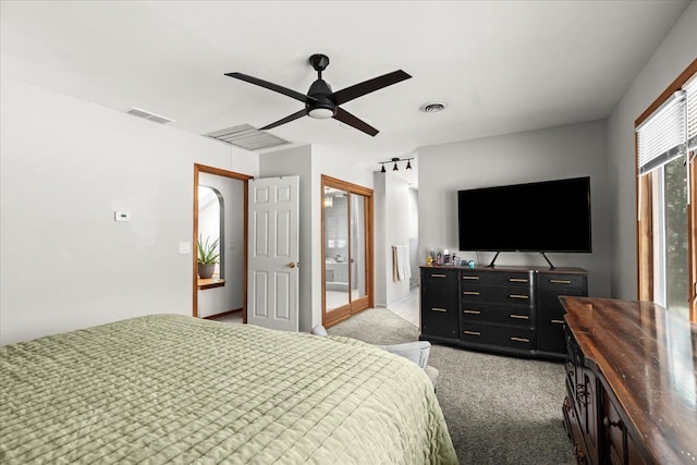 bedroom featuring visible vents, ceiling fan, and light colored carpet