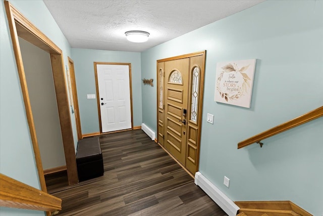 entrance foyer featuring baseboards, a textured ceiling, and dark wood-style floors