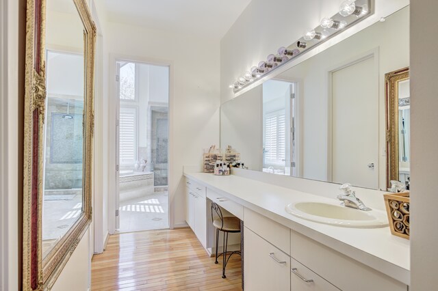 bathroom featuring vanity and wood finished floors