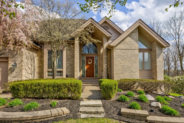 view of front facade featuring brick siding