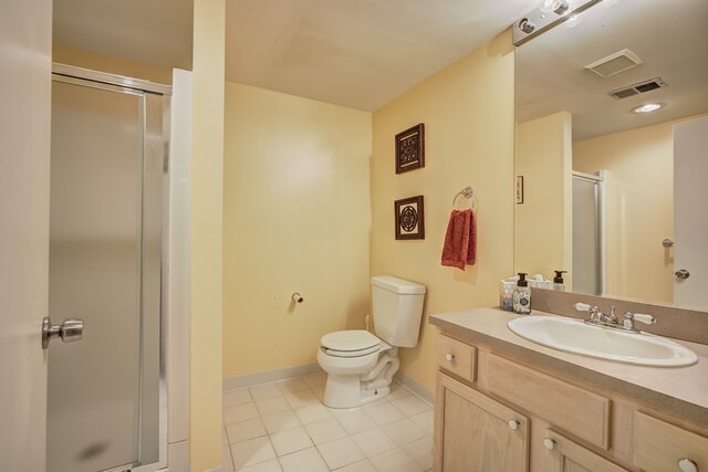 bathroom featuring tile patterned flooring, toilet, baseboards, a shower stall, and visible vents