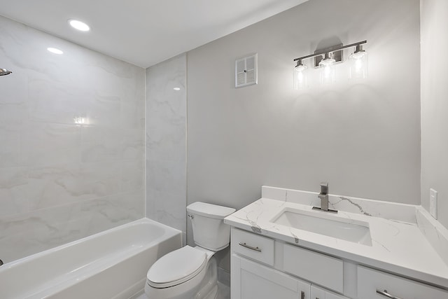 bathroom featuring visible vents, toilet, vanity, and  shower combination