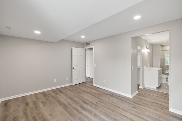 unfurnished bedroom featuring recessed lighting, light wood-type flooring, visible vents, and baseboards