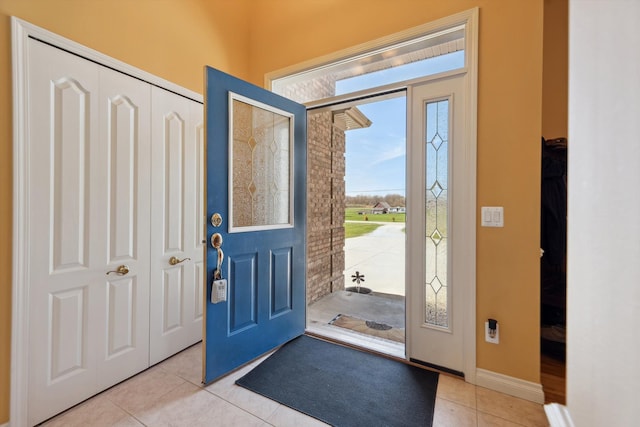 11613 Butler Rd, Willis, MI 48191 - entryway featuring baseboards and light tile patterned flooring