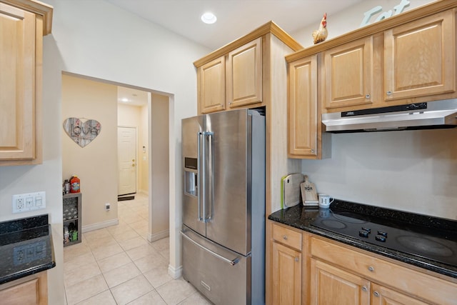 11613 Butler Rd, Willis, MI 48191 - kitchen with light brown cabinetry, dark stone countertops, stainless steel fridge with ice dispenser, under cabinet range hood, and light tile patterned floors