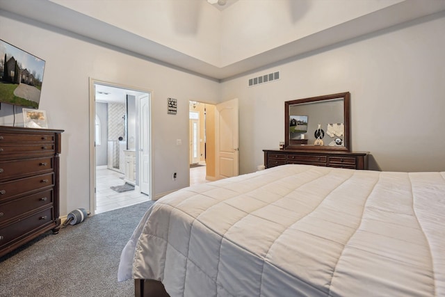 11613 Butler Rd, Willis, MI 48191 - bedroom featuring ensuite bath, visible vents, and carpet flooring