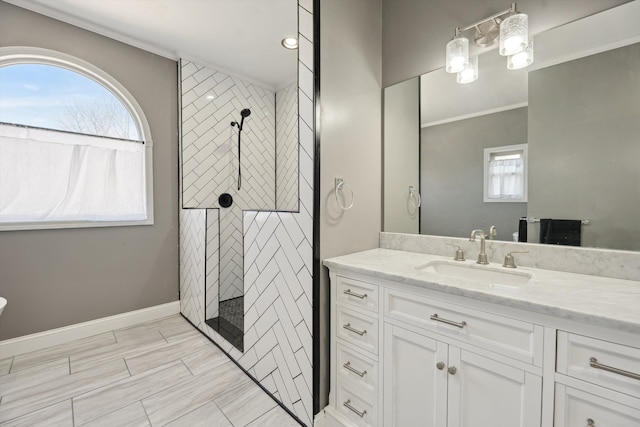 11613 Butler Rd, Willis, MI 48191 - full bath featuring a tile shower, baseboards, crown molding, and vanity