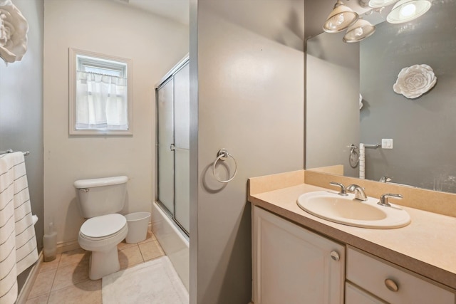 11613 Butler Rd, Willis, MI 48191 - full bath featuring tile patterned floors, vanity, combined bath / shower with glass door, and toilet