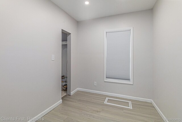 26358 Moses St, Flat Rock, MI 48134 - unfurnished room featuring baseboards, light wood-type flooring, and recessed lighting