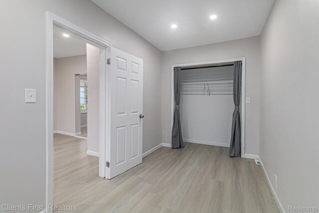 26358 Moses St, Flat Rock, MI 48134 - unfurnished bedroom with light wood-style floors, baseboards, recessed lighting, and a closet