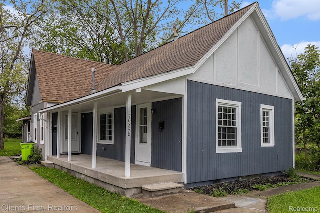 26358 Moses St, Flat Rock, MI 48134 - view of front of home with covered porch and a shingled roof