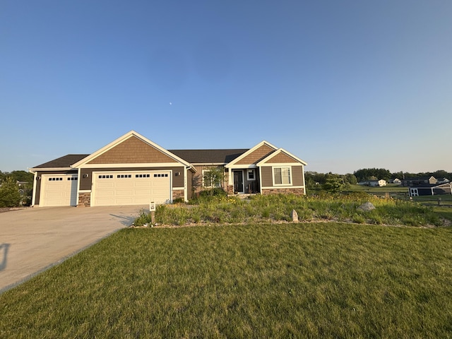 11726 Ridge Water Dr NE, Sparta, MI 49345 - craftsman inspired home featuring stone siding, an attached garage, a front yard, and driveway