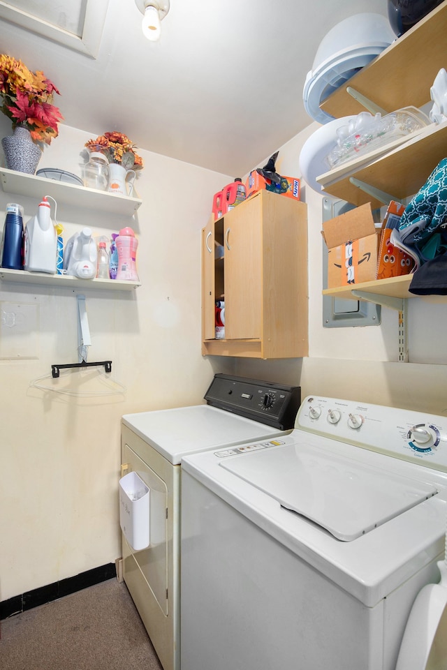 laundry area featuring washing machine and clothes dryer, baseboards, carpet, and cabinet space