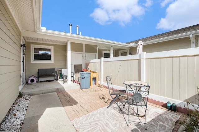 view of patio featuring fence