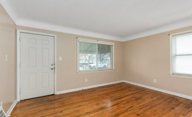 entryway with light wood-style floors and baseboards