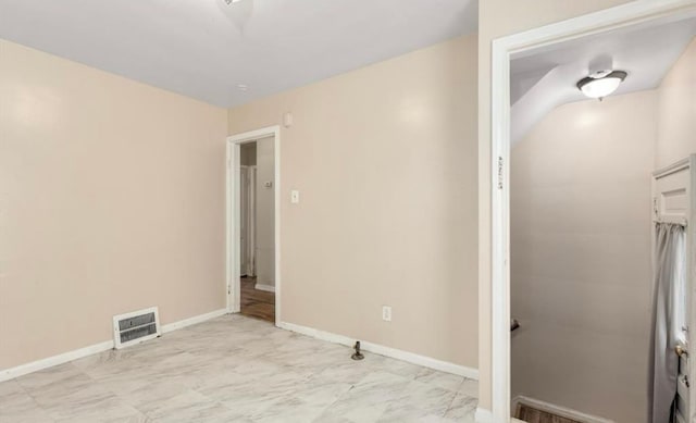 unfurnished bedroom featuring marble finish floor, visible vents, and baseboards