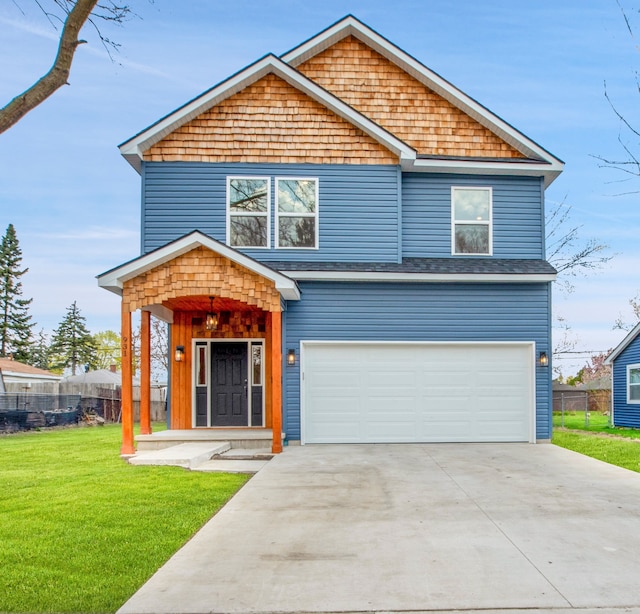 view of front of house featuring concrete driveway, a front lawn, fence, and an attached garage