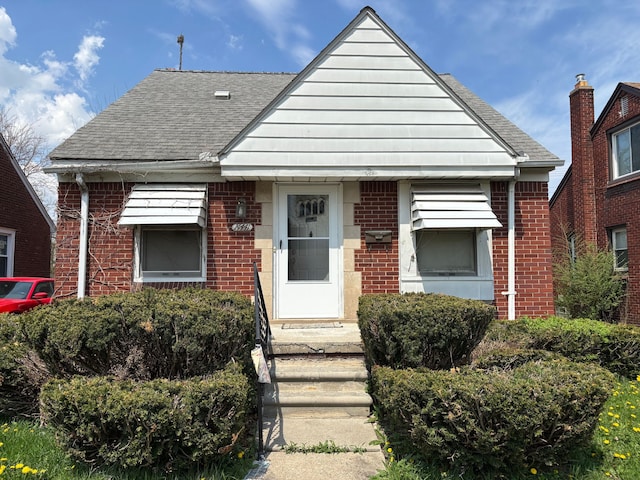 14441 Carlisle St, Detroit, MI 48205 - bungalow-style house featuring brick siding and roof with shingles