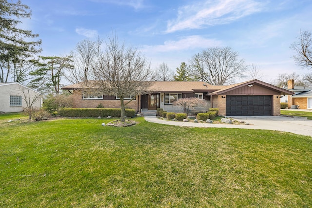 ranch-style home featuring brick siding, driveway, a front yard, and a garage