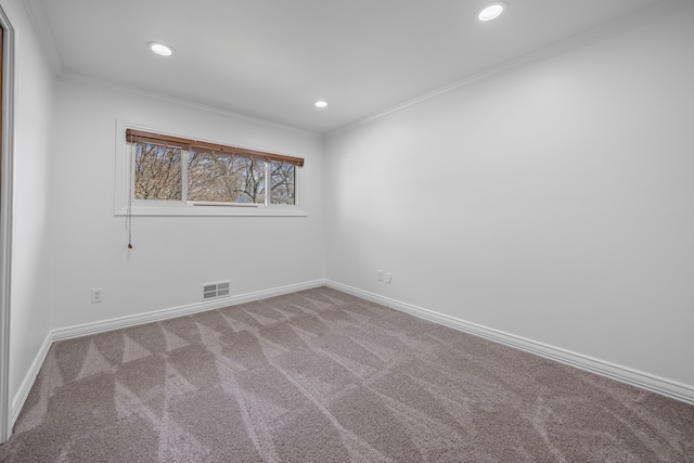 spare room featuring recessed lighting, baseboards, visible vents, and ornamental molding