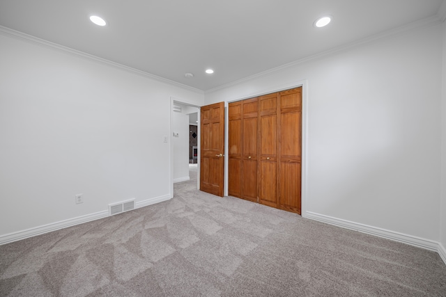 unfurnished bedroom featuring visible vents, recessed lighting, and light carpet