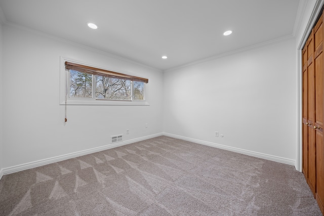 unfurnished bedroom featuring visible vents, crown molding, carpet floors, baseboards, and recessed lighting