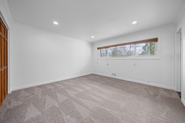 unfurnished bedroom with visible vents, crown molding, baseboards, carpet flooring, and recessed lighting