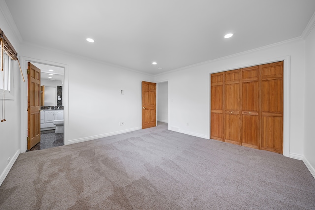 unfurnished bedroom featuring crown molding, carpet, a closet, and recessed lighting