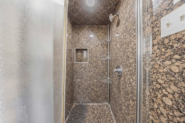 bathroom with a stall shower