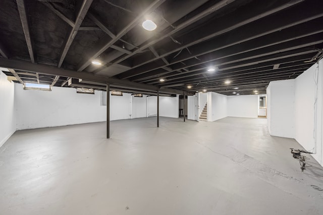 finished basement featuring stairway