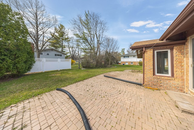 view of patio / terrace featuring fence